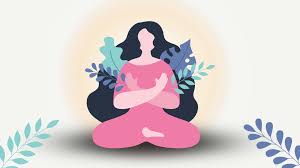 A woman meditating outside surrounded by nature